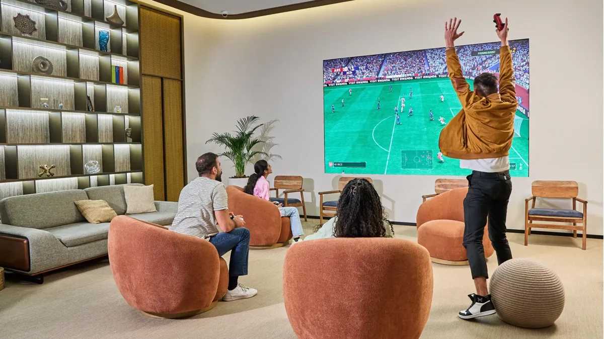 Guests playing a football video game at Power Play